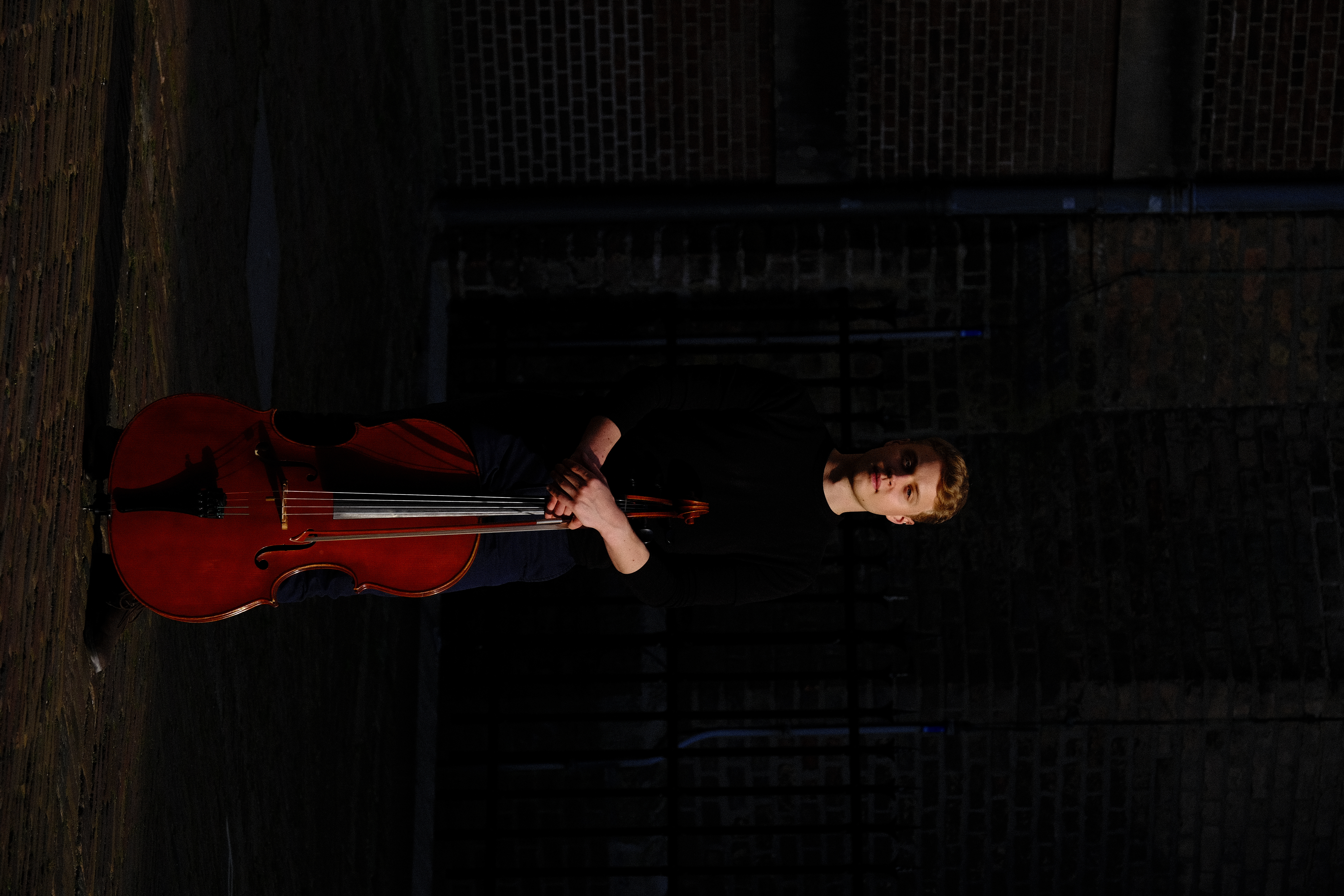Cellist Luka Stefanović portrait with cello, The Hague